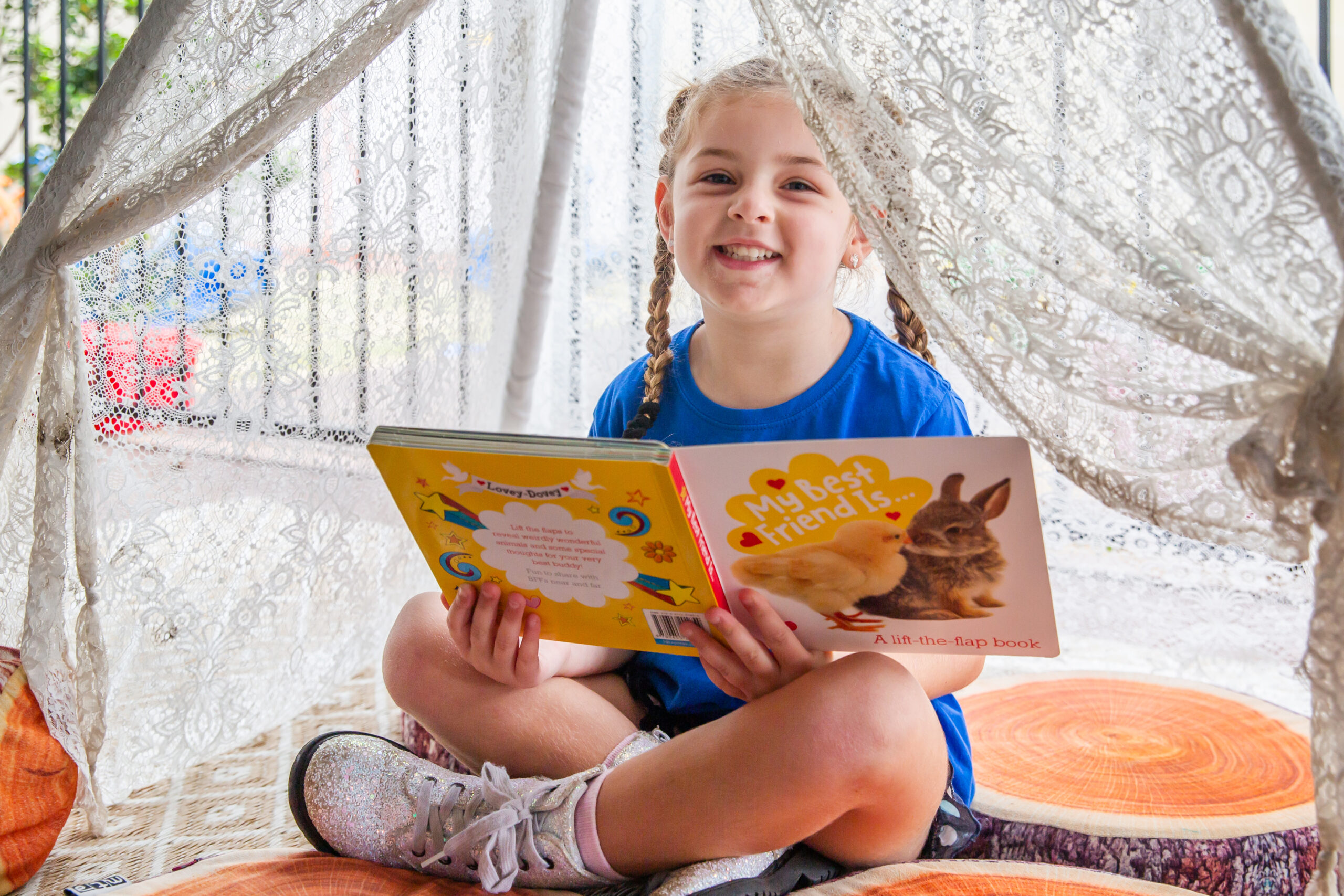 Milestones Toronto | Early Education & Child Care in Toronto | Child reads a book at Milestones Toronto